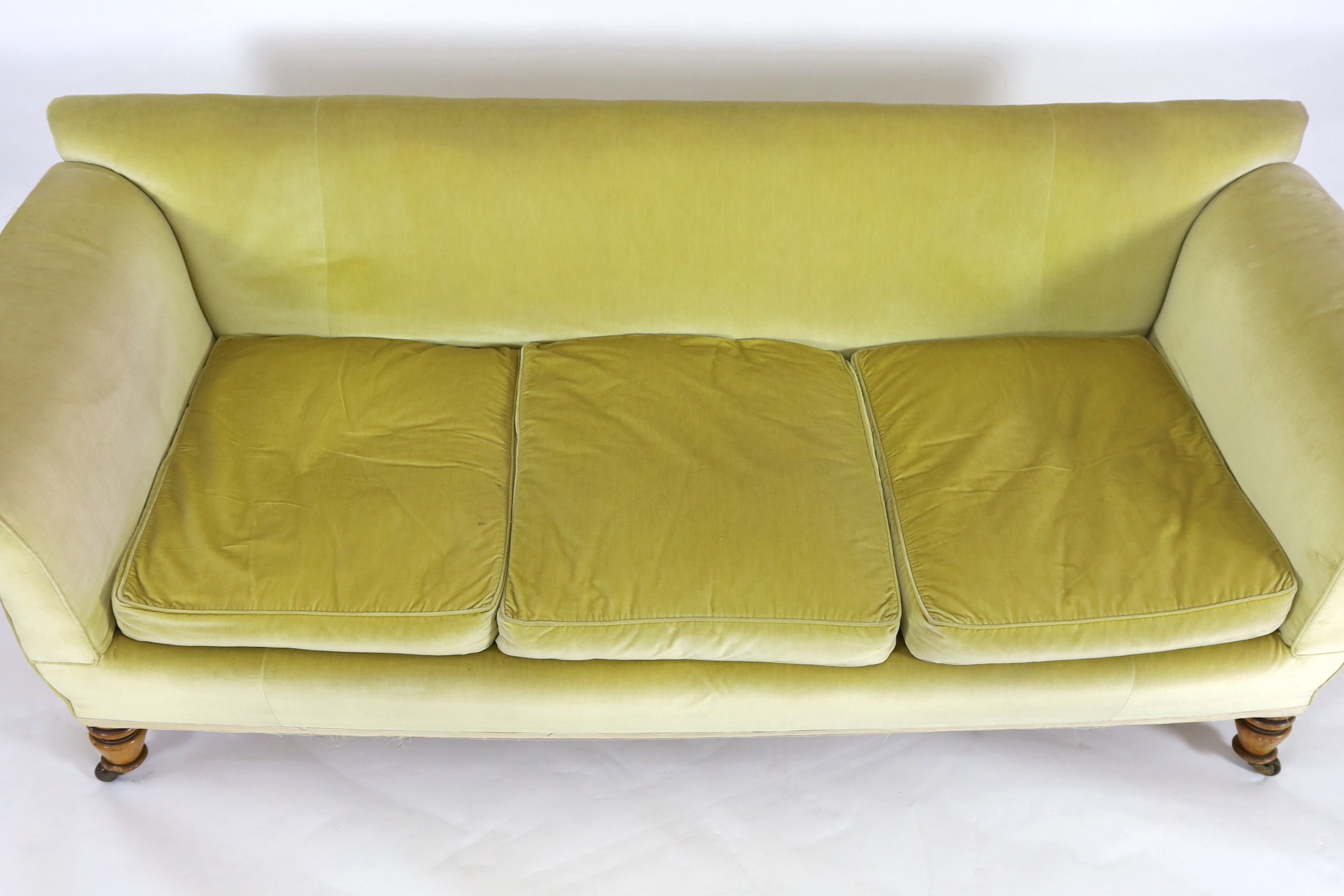 A large Victorian style sofa in the manner of Howard & Sons, 240cm wide, 92cm deep, 85cm high